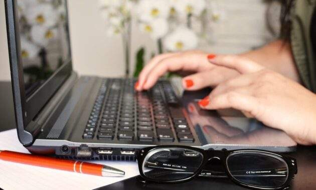 person woman desk laptop